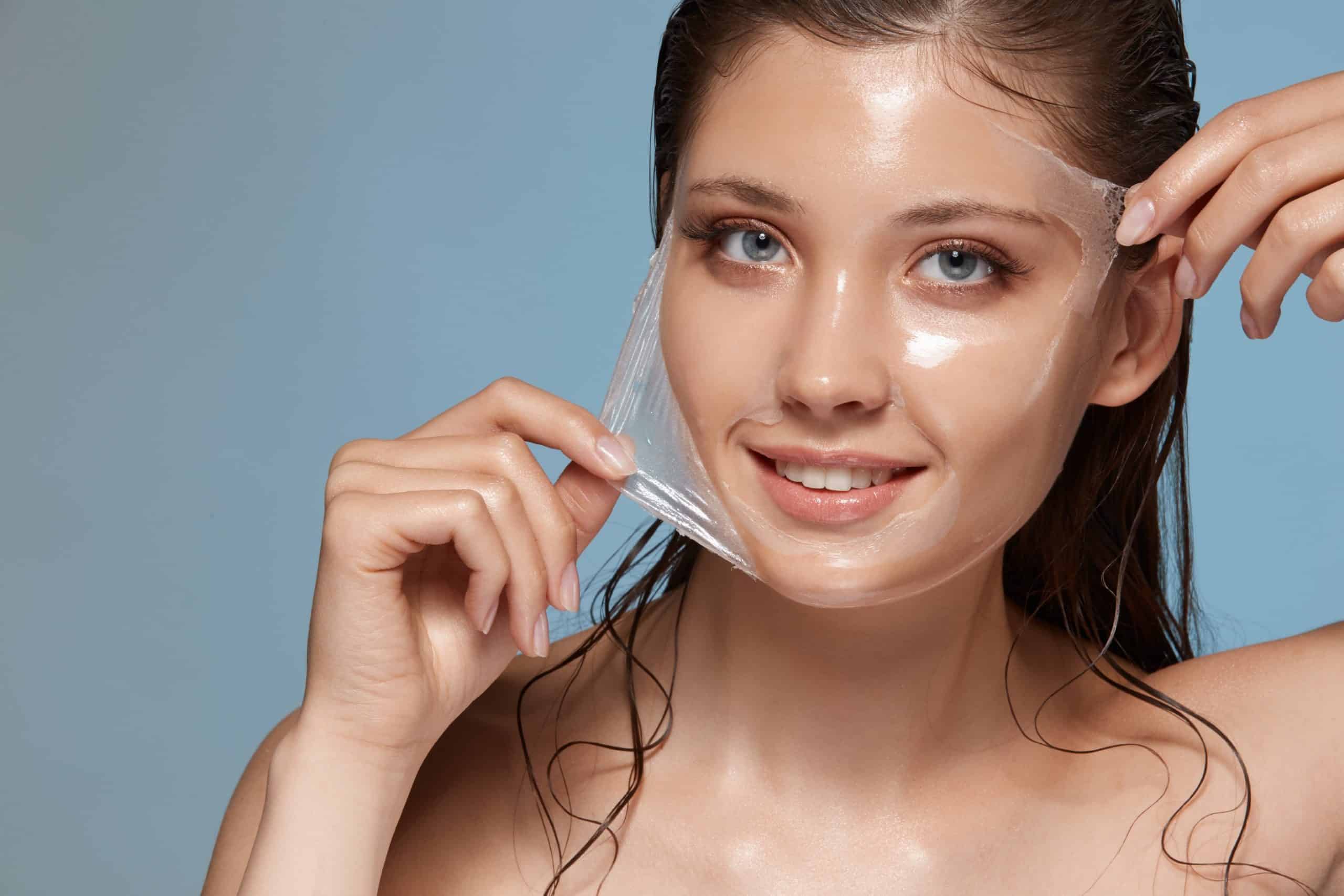 Attractive woman removing moisturizing mask and looking at camera | Bellava Aesthetics in Crestview Hills, KY