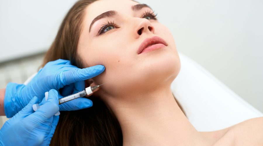 Pretty lady getting injection on cheeks | Bellava Aesthetics | Medical Spa in Crestview Hills, KY